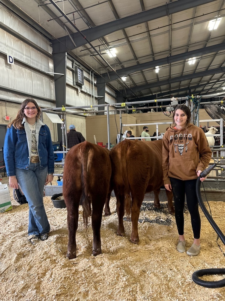Lacey Tinney and Makaila Stutts with their Red Angus females  